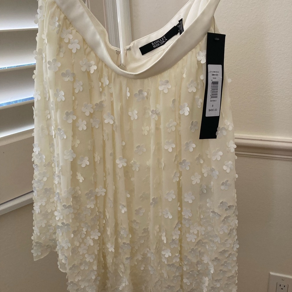 Badgley Mischka skirt with appliqué flowers.